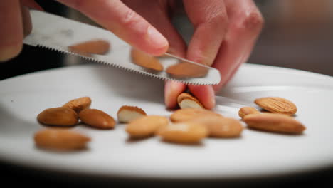 cook hands divide almonds dried fruit to season desserts