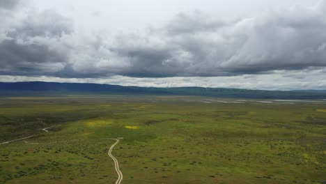 Lush-Green-Plains-With-Overcast-In-The-Sky-At-Daytime