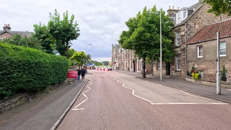 street closure with pedestrians and traffic signs