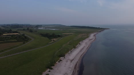 aerial view of empty beach in northern germany during a calm morning with clouds (falshoeft, schleswig-holstein)