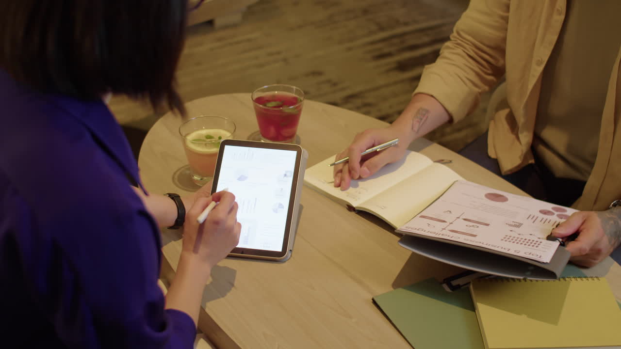 Unrecognizable Entrepreneurs Working on Business Plan