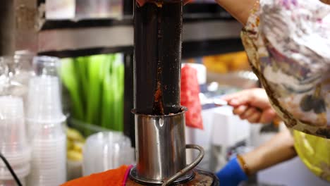 making fresh juice with a manual juicer