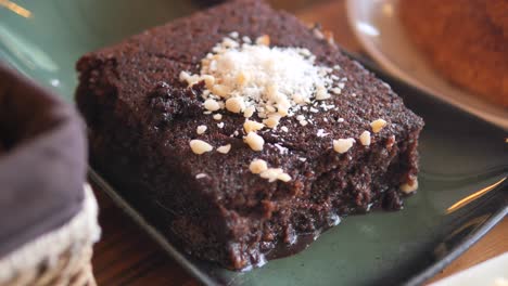 chocolate cake slice with coconut and nuts