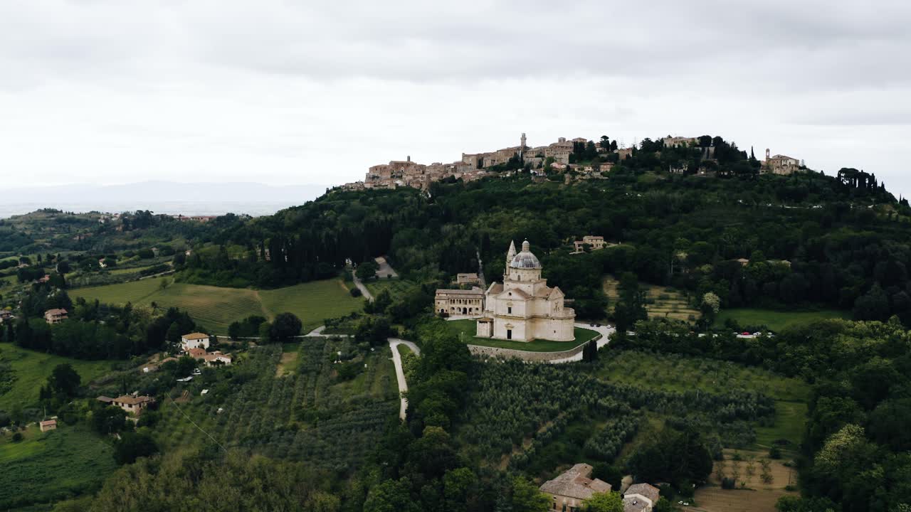 Wide aerial view of Italy's rural countryside with a lone church