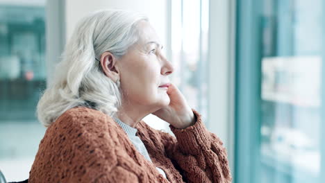 senior woman, window or thinking with depression