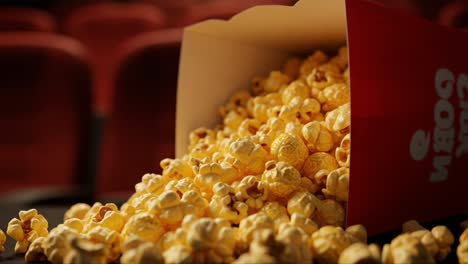 a cinematic delight: overflowing popcorn box in a movie theater, capturing the joyful essence of movie nights with friends and family
