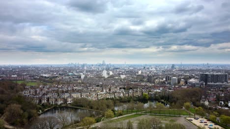 wide aerial view of city of london from hampstead heath on cloudy day