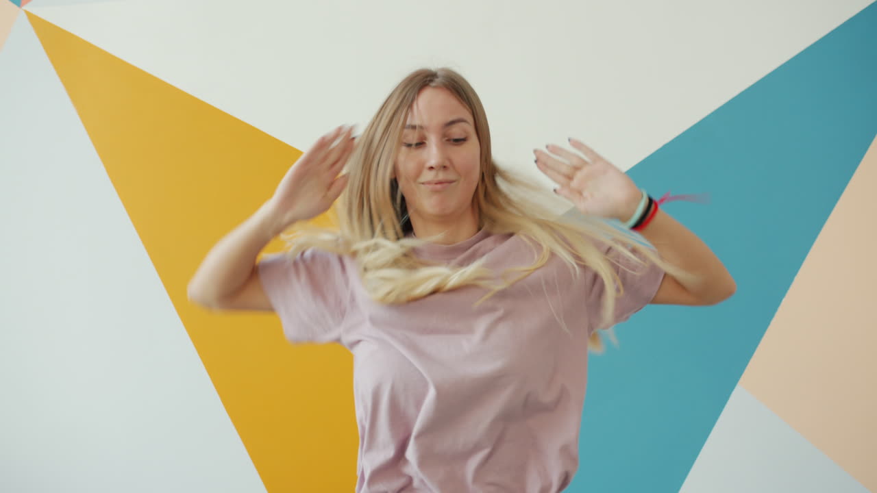 Woman Dancing in a Colorful Studio