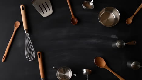 assortment of kitchen utensils on a dark background