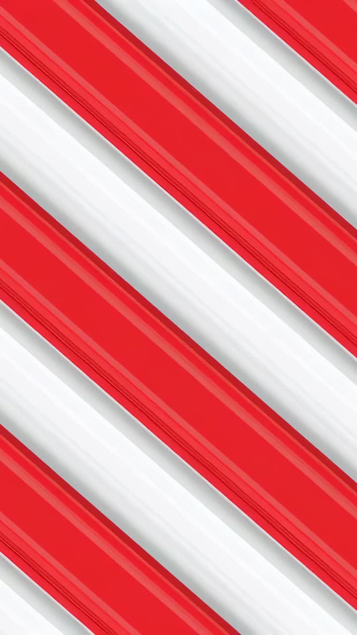 Vertical video: Looping red-white angled stripes filling abstract field, showing shiny ridges