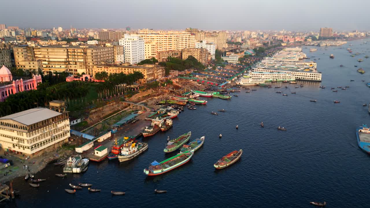 Drone shot crowded overpopulated city in Asia with buildings and river