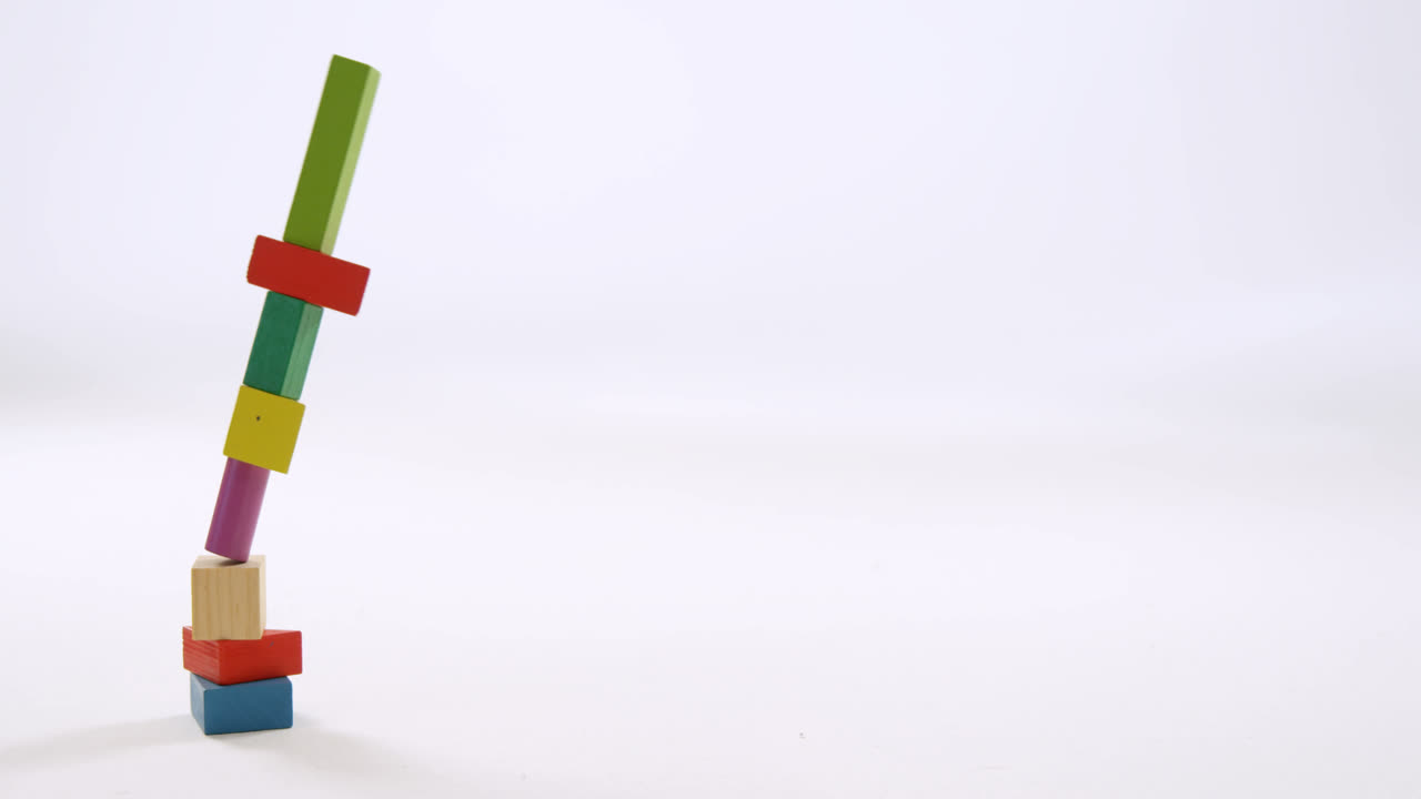 Toy blocks falling on white background 4k