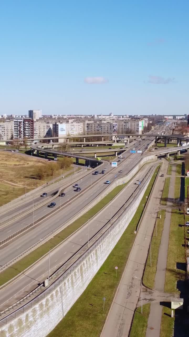 Vertical drone view of busy road, drivers commuting to work, rising, Riga