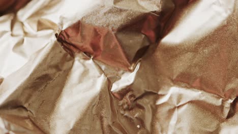 close up of brown crumpled piece of paper in slow motion