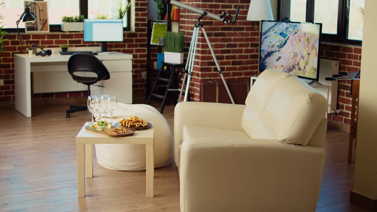 Empty stylish cozy apartment living room with charcuterie board and cheese plater on wooden table