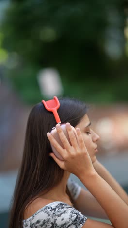 woman enjoying music outdoors