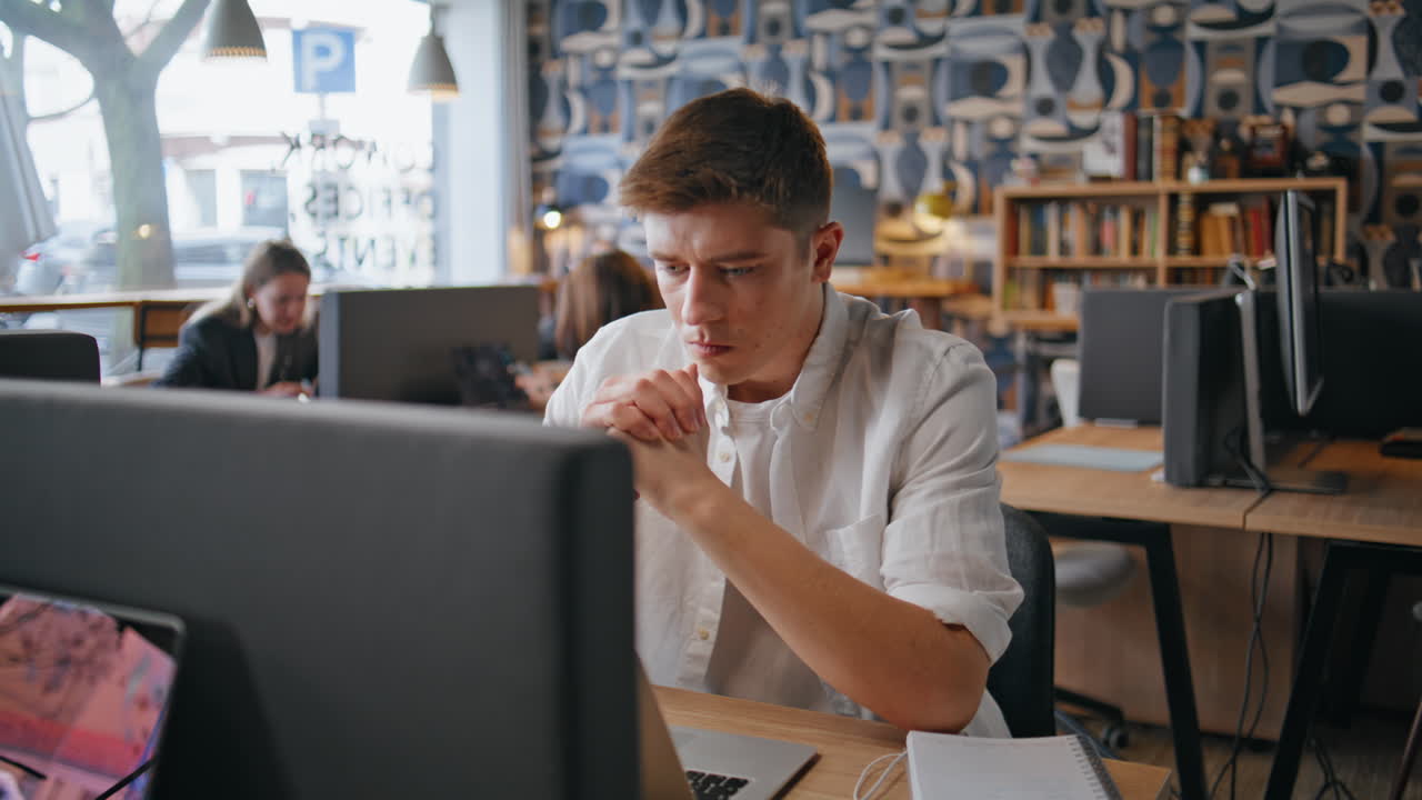 Thoughtful businessman staring computer at buro closeup. Man looking solution