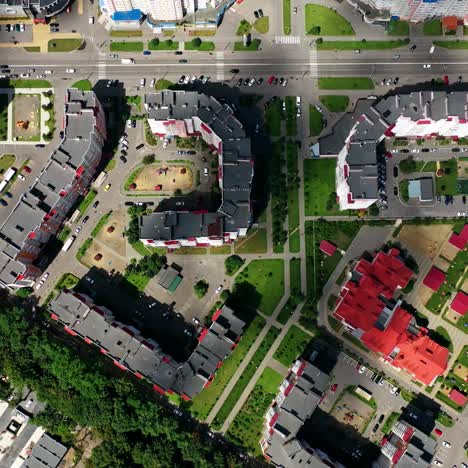 cityscape from above. modern downtown. rooftops of architectural buildings in urban district. motion camera to the right.