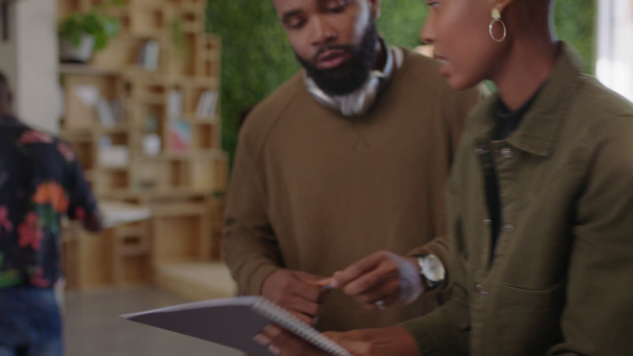 business people meeting brainstorming sharing ideas colleagues working together on corporate project planning successful strategy for deadline in busy office