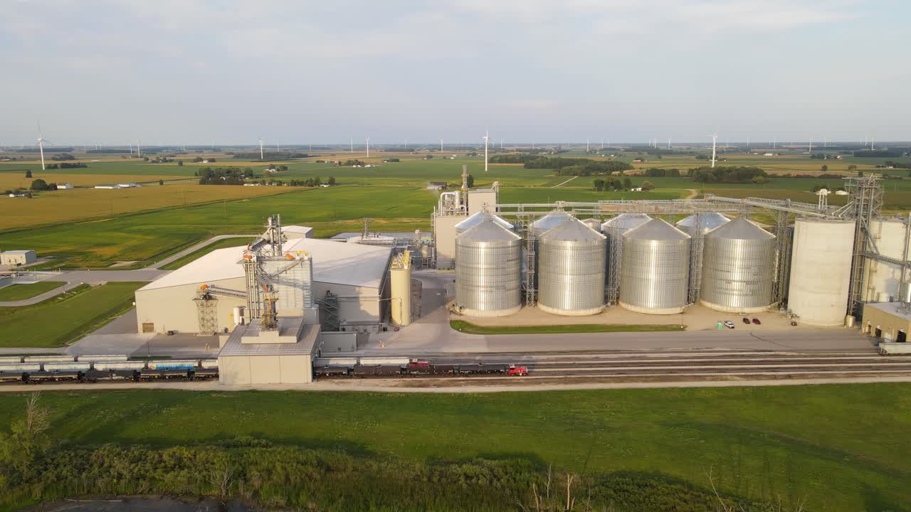 New modern silos and massive facility with railway for grain export, aerial view