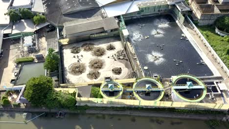 aerial top view 4k of waste water treatment system in industrial estate