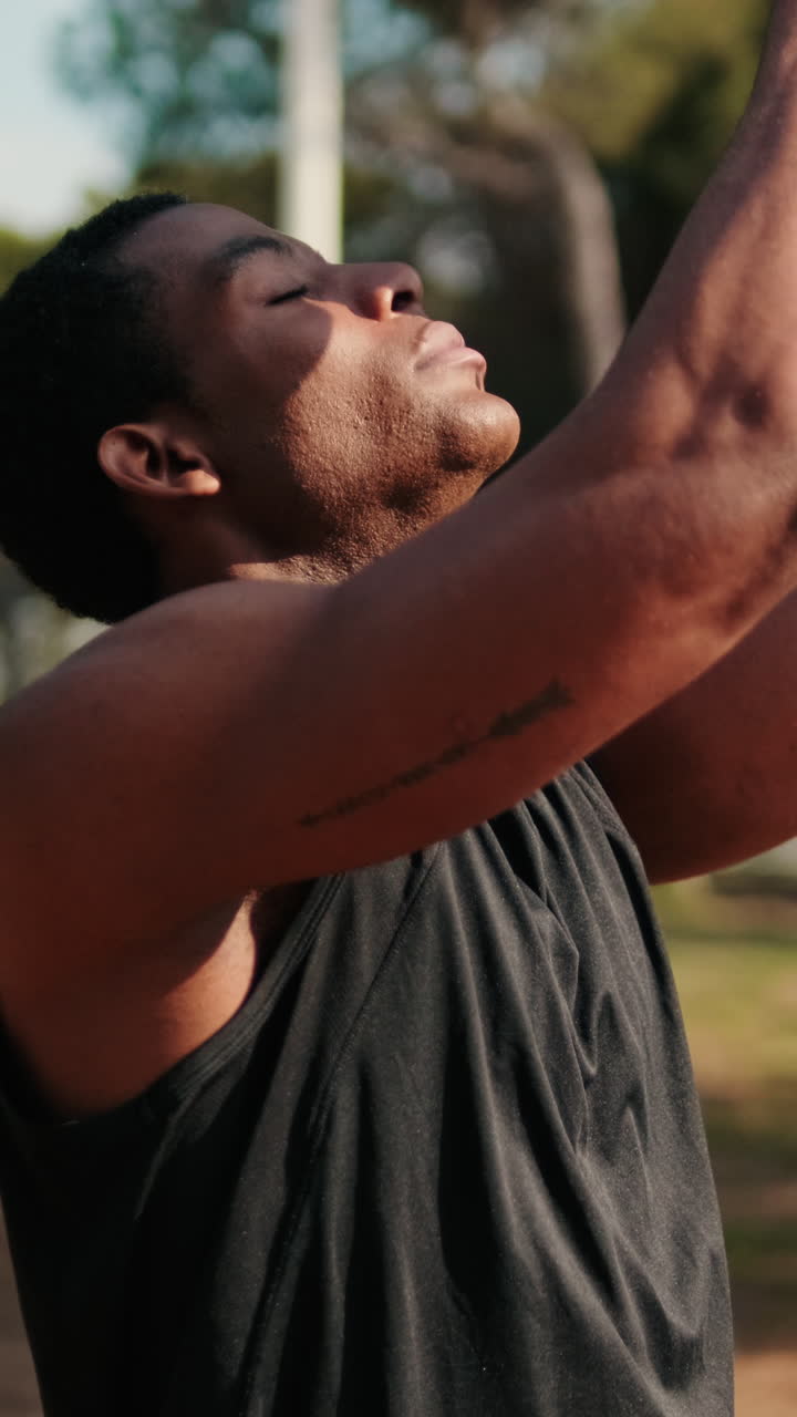 Young Man Meditates in the Park