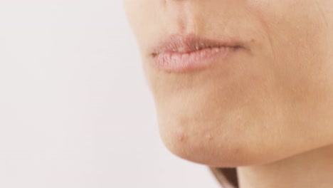 close-up of woman eating wafer. eating chocolate.