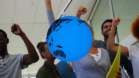 animation of globe over business colleagues smiling and cheering