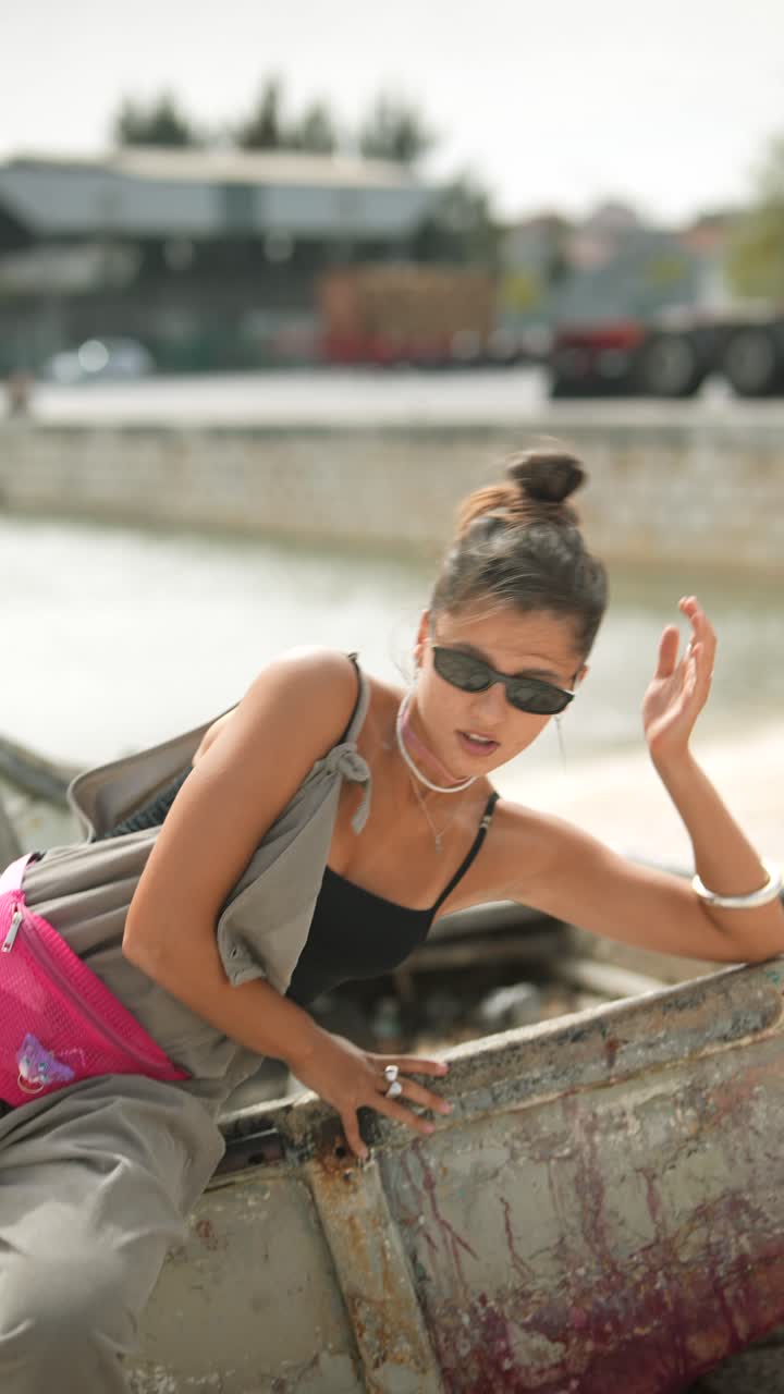 Woman in Sunglasses Posing Outdoors