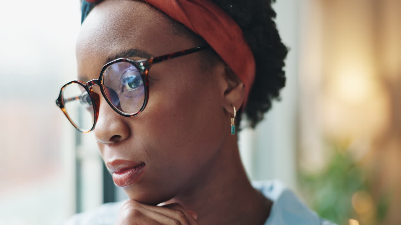 Portrait of a woman with glasses and a headband