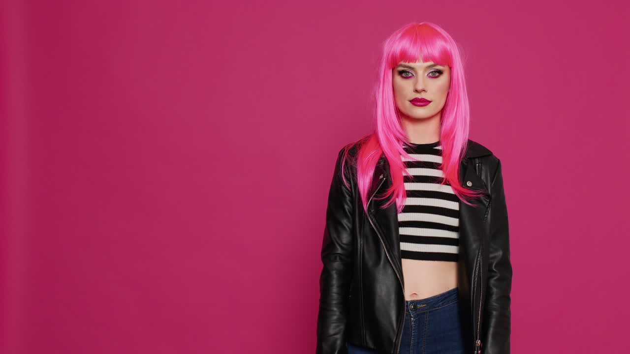 Stylish attractive person giving thumbs up on camera