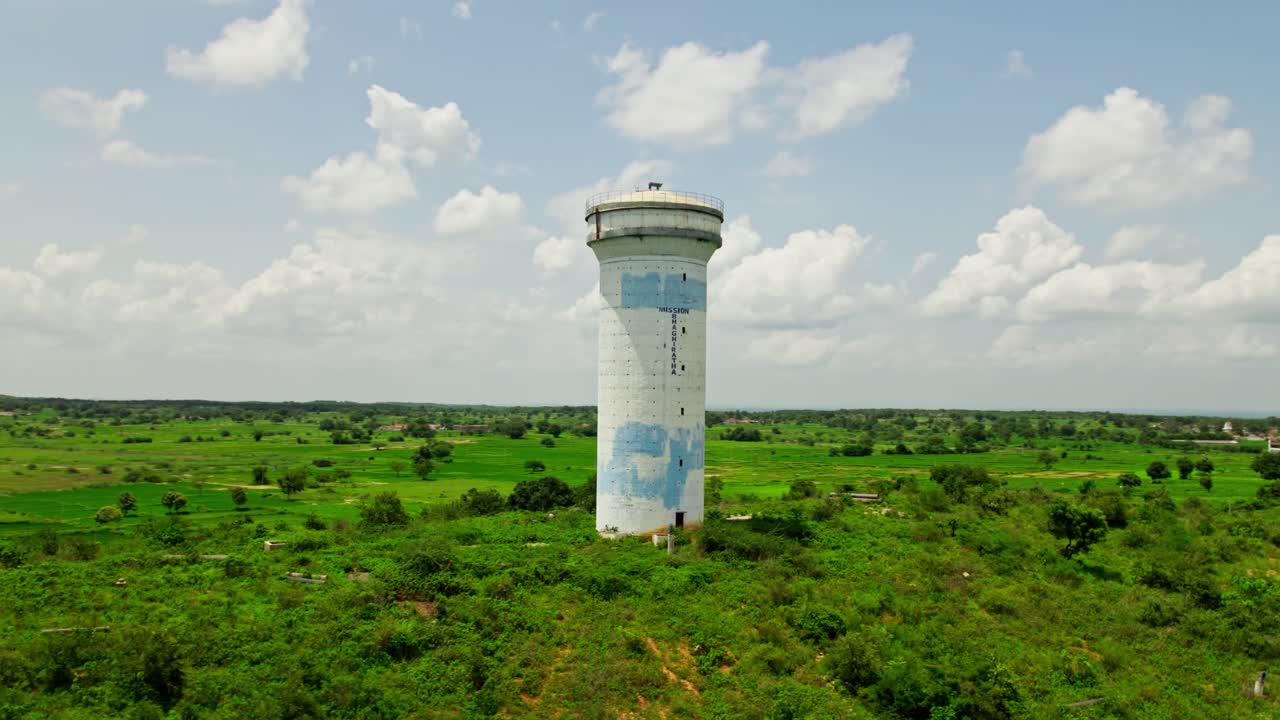 mission bhagiratha water tank with greenery and lake at tekmal village, medak, telangana, india. day time, circle shot, drone shot, 4k.