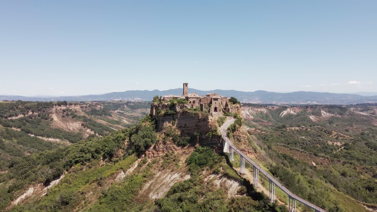 Drone footage panning into the ancient village of Civita di Bagnoregio, also known as "The Dying City", in Italy