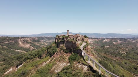 drone footage panning into the ancient village of civita di bagnoregio, also known as "the dying city", in italy