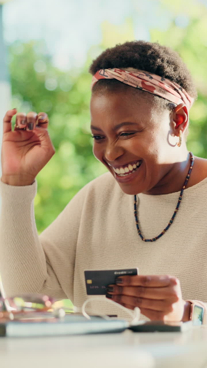 Happy Woman Making Online Purchase with Credit Card on Laptop