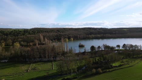 Dampierre-sur-Avre-pond-and-surrounding-rural-landscape,-France