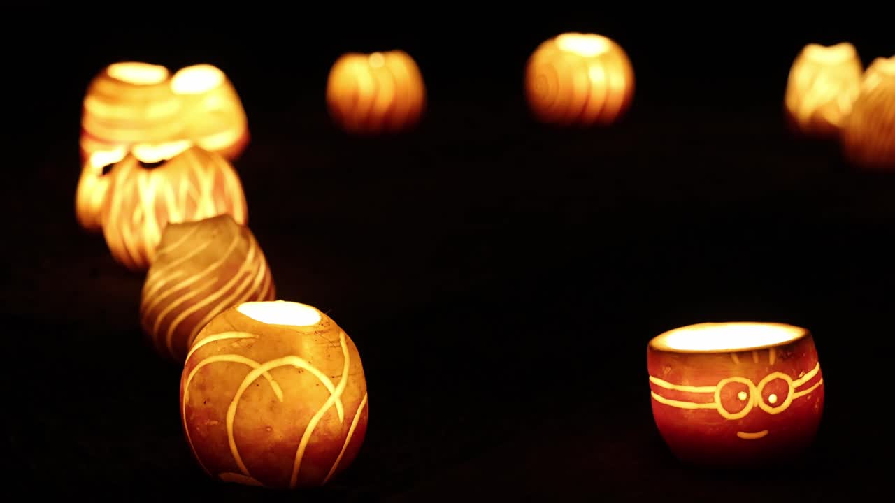 Carved turnips with glowing candles, traditional autumn light decor