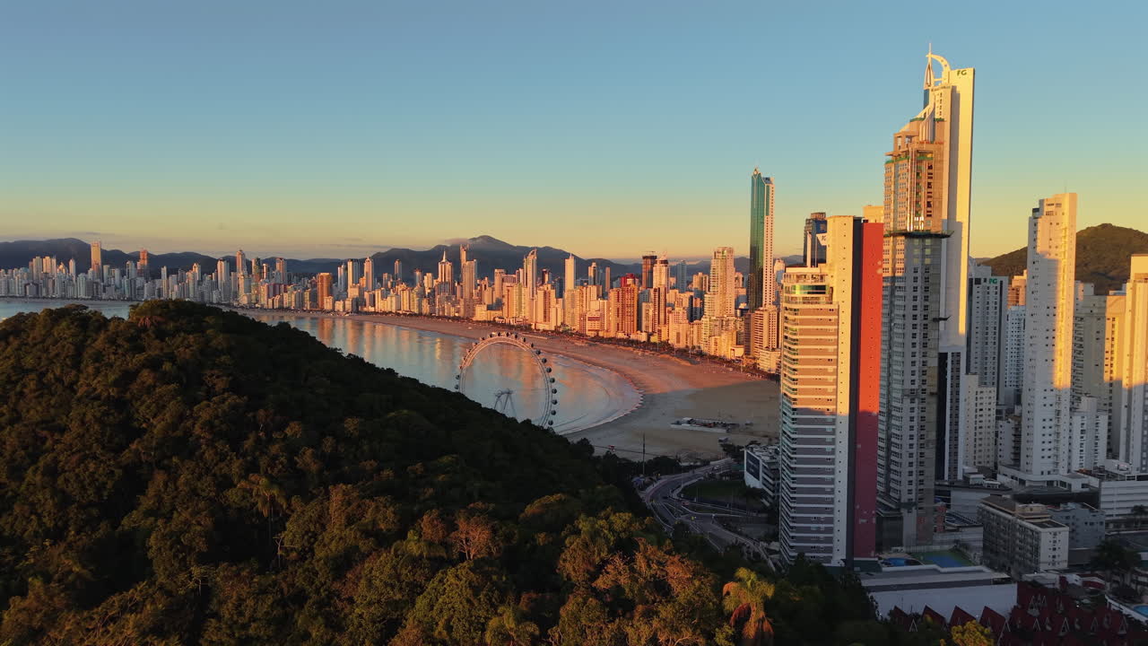 Aerial view of skyline of luxurious and modern Balneario Camboriu coastal city at sunrise, Brazil
