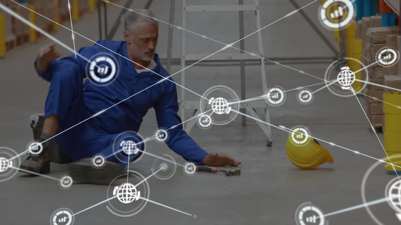 red de iconos digitales contra un trabajador caucásico de edad avanzada que cae de una escalera en un almacén