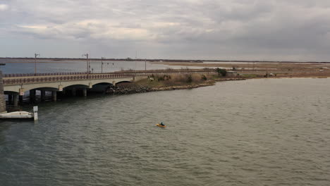 An-aerial-shot-over-a-salt-marsh-on-a-cloudy-day