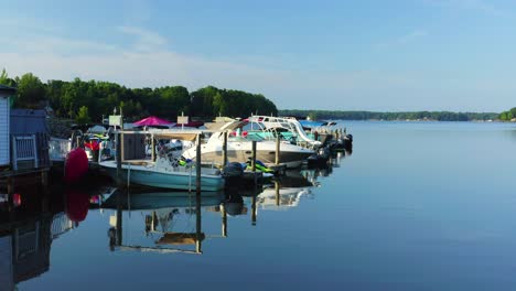 Bird's-Eye-Drone-Dolly-Right-of-Boats-Docked-on-Lake-Norman-in-the-Fall,-North-Carolina