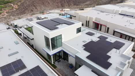 Solar-panels-on-an-ultra-modern-design-home---dynamic-aerial-view-in-Henderson,-Nevada