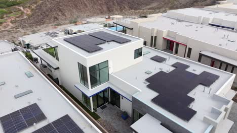 solar panels on an ultra modern design home - dynamic aerial view in henderson, nevada