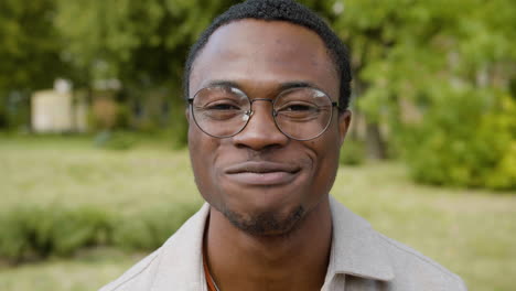 portrait of young man in a park