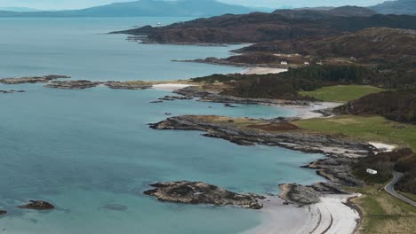 approaching traigh beach, scotland, with isle of skye and highlands in background