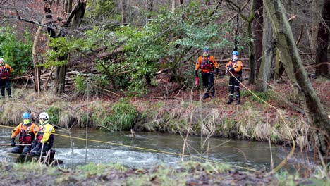 coastguards training for a river rescue - throwing ropes