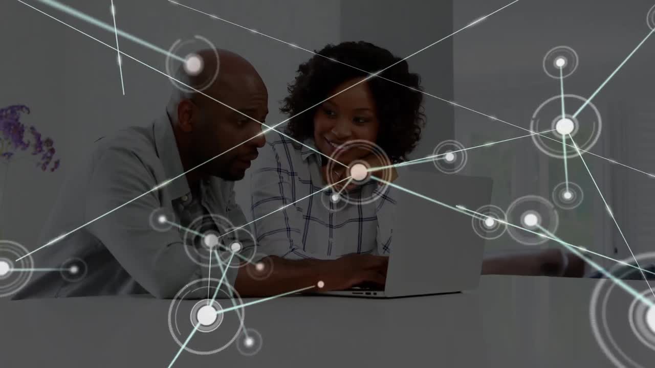 Animation of network of connections over happy african american female and male workers in office