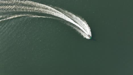 Aerial-view-captures-the-exhilarating-thrill-of-a-jet-ski-cutting-through-the-water