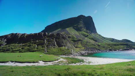 panorama of lovund island, mountain and white-sand beach in summer in norway