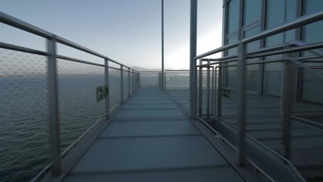 Botin-Centre-in-Santander,-Spain-designed-by-Renzo-Piano-travelling-forward-in-a-gangway